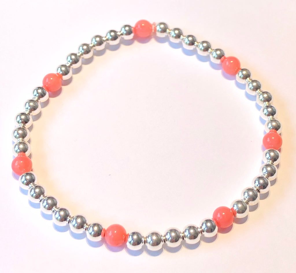 4mm Sterling Silver Bead Bracelet with 7 4mm Pink Coral Beads