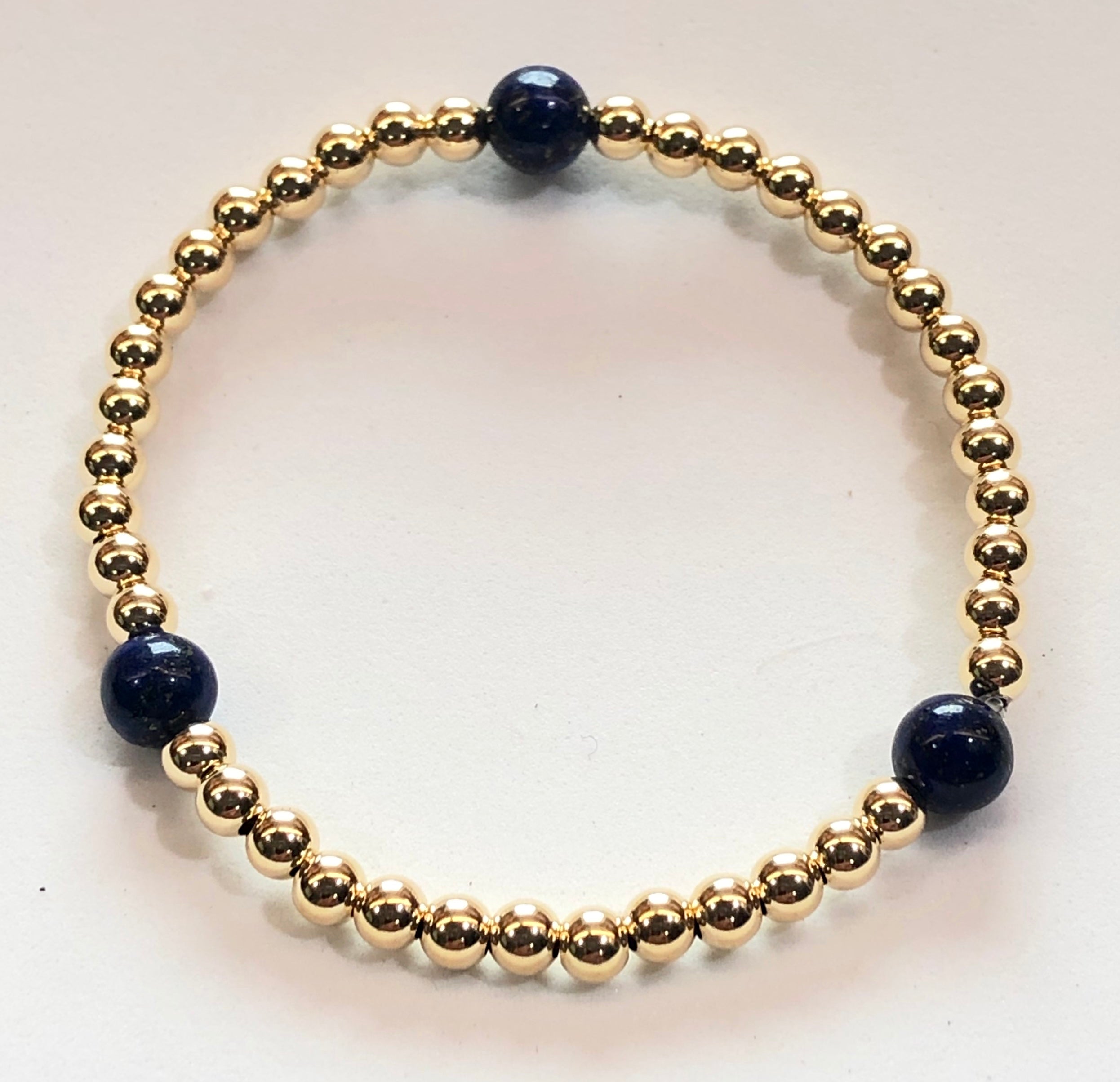 4mm 14kt Gold Filled Bead Bracelet with 3 6mm Blue Lapis Beads